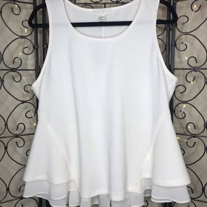 Delicate peplum top with sheer detailing